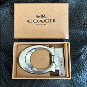 New in box! Coach Metallic Silver Belt Buckle -Iconic Coach “C” Logo